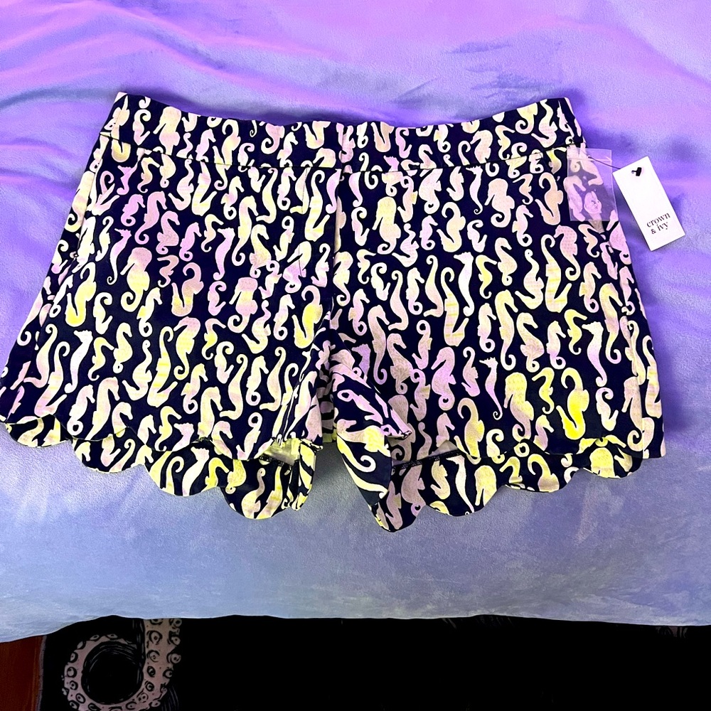Seahorse shorts with scalloped edges.